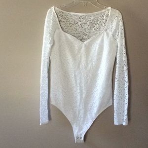 White, long sleeved lace body suit